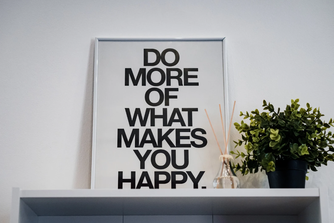 Picture of a sign that says DO MORE OF WHAT MAKES YOU HAPPY