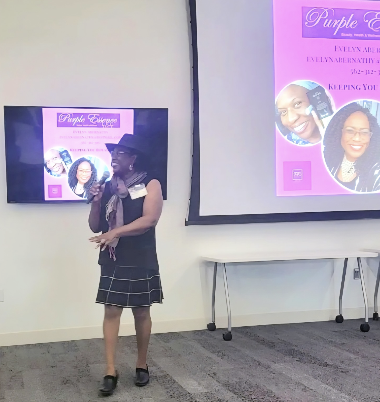 Evelyn Abernathy presenting Purple Essence By Evelyn at a business event