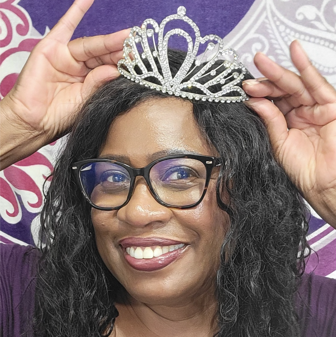 Evelyn Abernathy smiling and adjusting a silver tiara, celebrating confidence and embracing her Queen Era after 40.